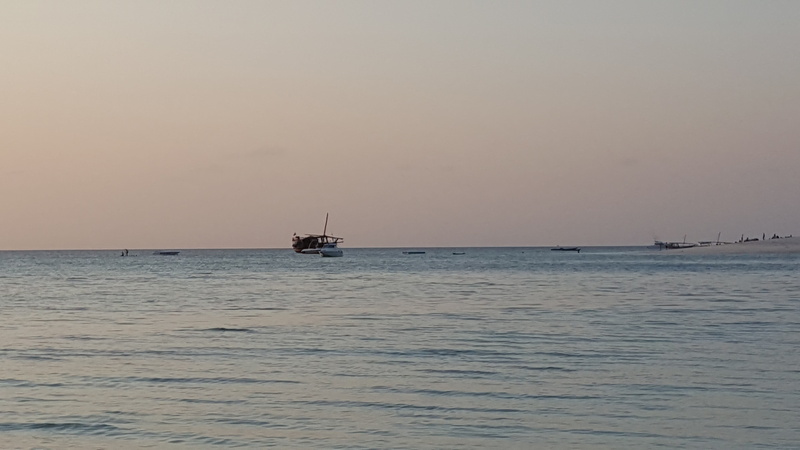 sailboat, nautical vessel, anchored, tropical, outdoors, nature, water, no people, sea, tanzania, waterfront, mode of transportation, horizon, tranquil scene