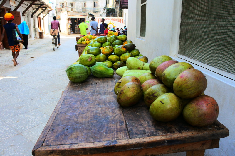 zanzibar, building exterior, wellbeing, 5K, for sale, market stall, mango, street, africa, group of people, fruit, food, market, healthy eating, street market