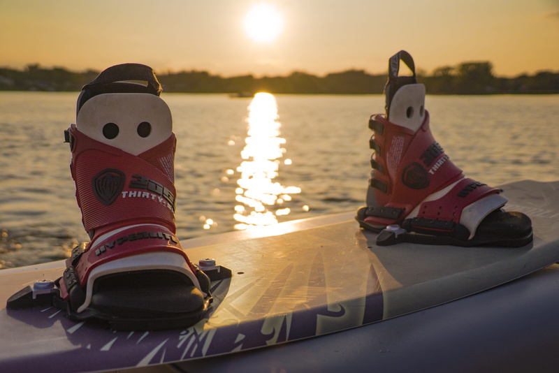 lifestyle, scenics - nature, beauty in nature, transportation, shoe, athlete, towing, water, sport, board, summer, fun, no people, sky, surfing, mode of transportation