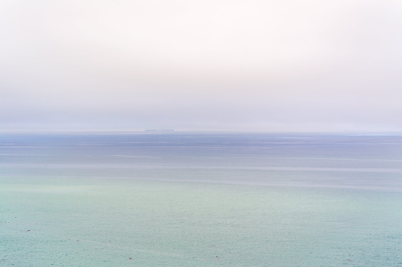 beauty in nature, tranquil, field, landscape, foggy, oceanview, idyllic, ombre, scenics - nature, remote, day, tranquil scene, fog, horizon, pink, calm