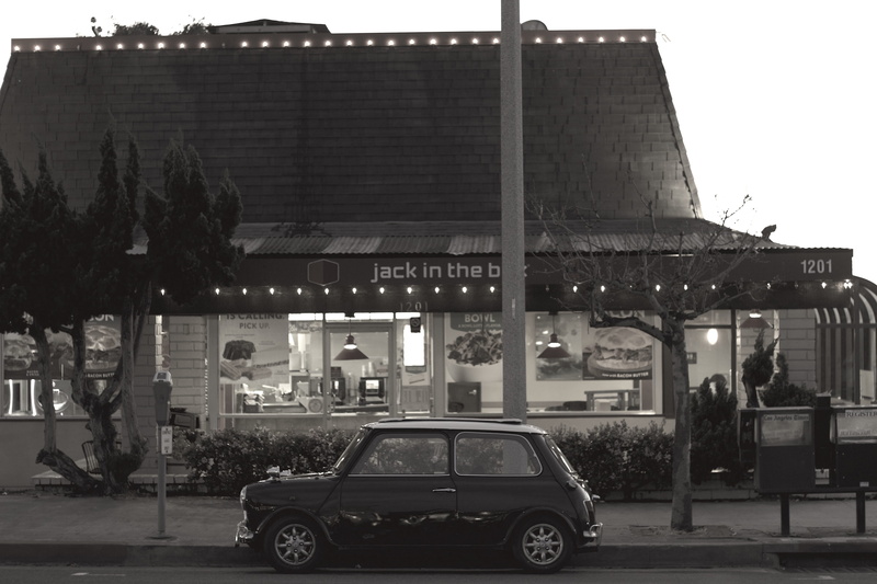 incidental people, evening, lights, building exterior, nature, residential district, beach, land vehicle, built structure, small, california, day, restaurant