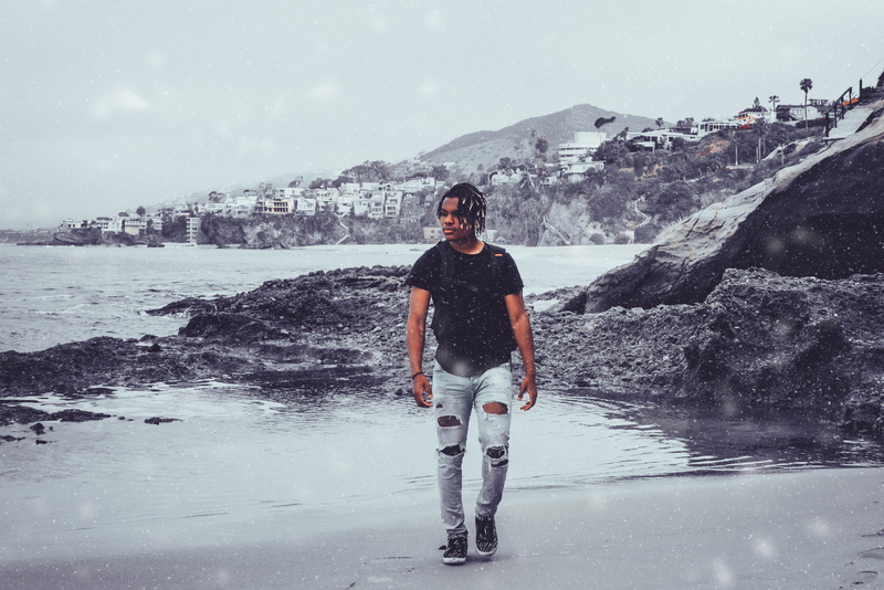 front view, real people, california, day, young adult, cold temperature, laguna beach, one person, nature, snowing, outdoors, full length, extreme weather