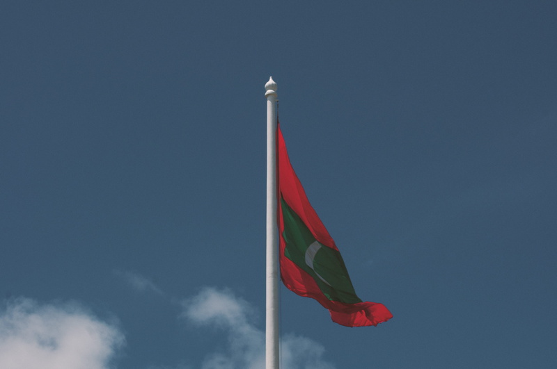 paradise, maldives, national flag, copy space, pole, maldives islands, blue, flag, no people, country, flag pole, sky, multi colored, flying, low angle view