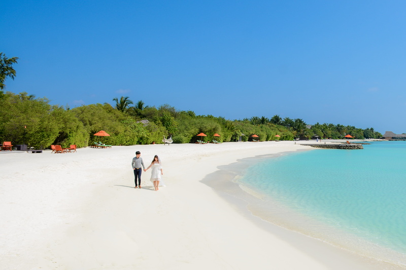 people, woman, water, sky, outdoors, two people, real people, umbrella, sand, scenics - nature, resort, coastline, white sand, shoreline, walk, maldives