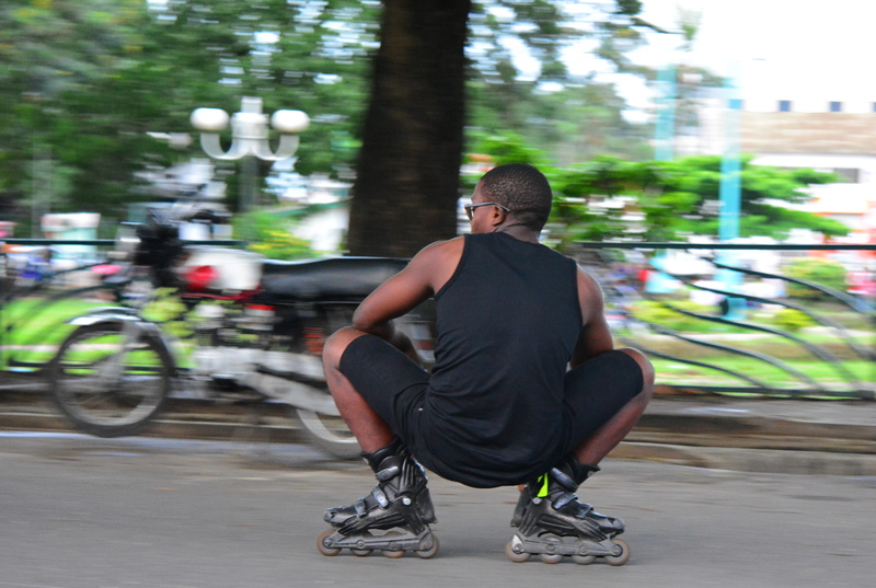 real people, 4K, casual clothing, douala, mode of transportation, men, nikon, streets, leisure activity, blurred motion, teenager, cameroon, riding, bicycle