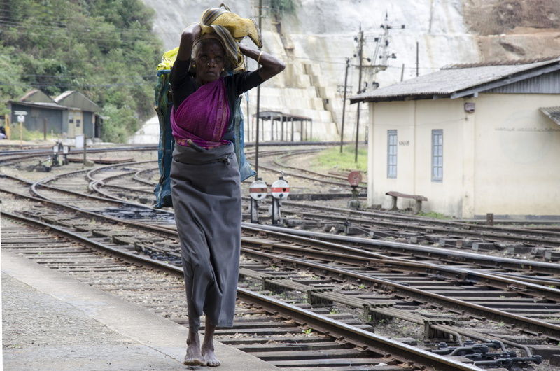 real people, built structure, public transportation, 4K, hairstyle, one person, rear view, architecture, railroad station, transportation, the woman at the train station