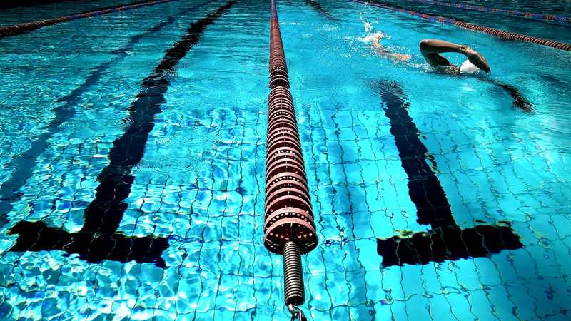 reflection, leisure, sunlight, fitness, athlete, swimming pool, swimming, rippled, swimmer, competition, waterfront, tile, close, aquatic sport, outdoors