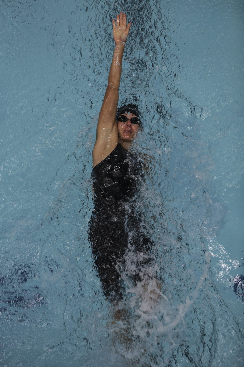 human arm, outdoors, leisure activity, waterfront, high angle view, sport, arms raised, swimming pool, backstroke, day, shirtless, 5K, competition, man