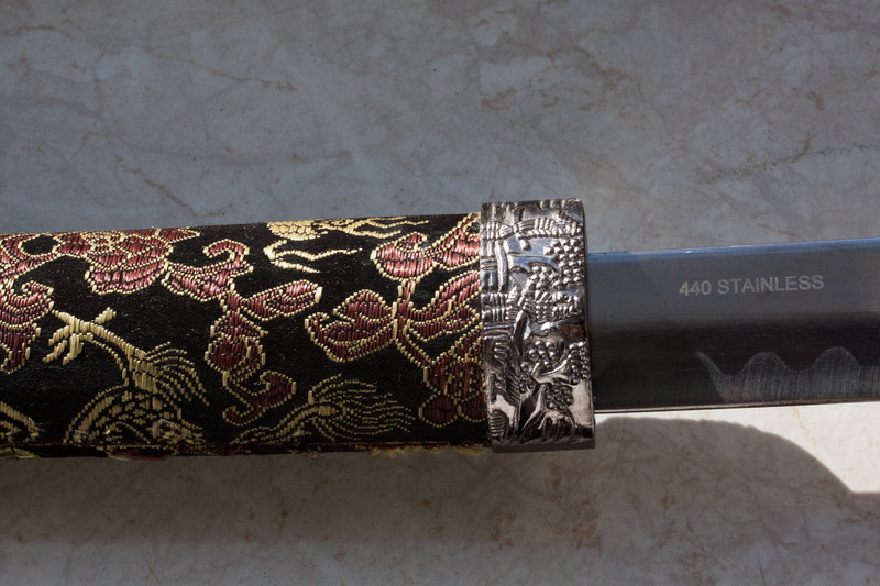 floral pattern, table, hamon, called, craft, ornate, daitō, personal accessory, pattern, real sword, saya, box - container, nature, close-up, textile, shadow