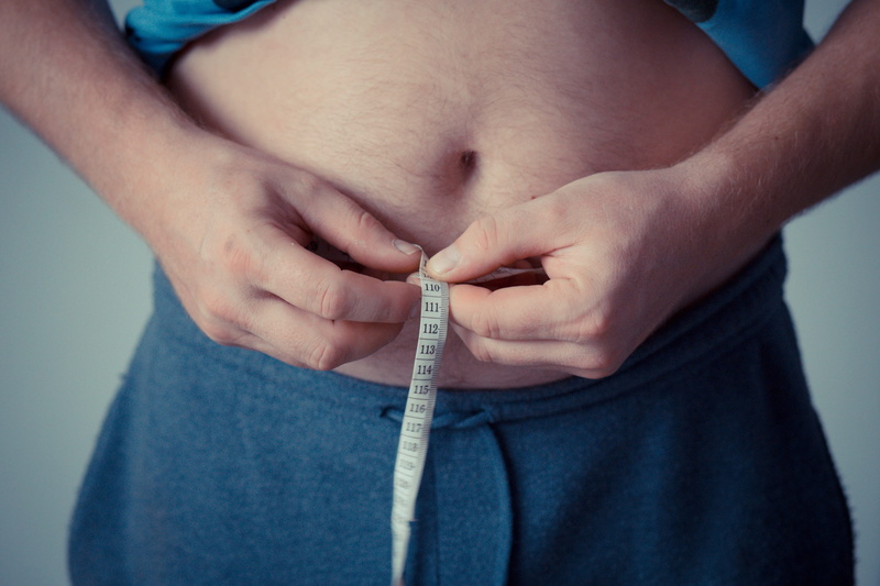 body part, weigh, measuring, indoors, human hand, studio shot, textile, 2K, human limb, fat, jeans, healthcare and medicine, close-up, getting dressed