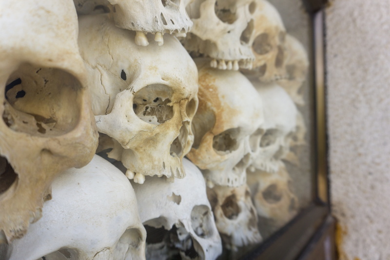 skulls, bokeh, human, art, spooky, stack, choeung ek genocidal center, indoors, bone, eyes, sculpture, spirituality, architecture, skull, decor, human bone
