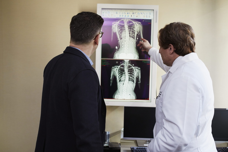 technology, research, pointing, men, laboratory, waist up, occupation, wearing, black, x-ray, lab coat, man, 5K, result, patient, side view, healthcare and medicine
