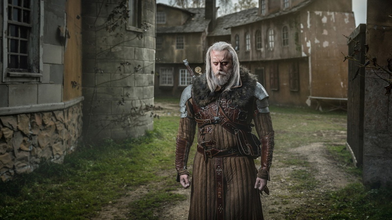 one person, medieval, the past, spooky, warrior - person, building, looking at camera, fear, weapon, emotion, period costume, Cosplay, outdoors, Geralt of Rivia