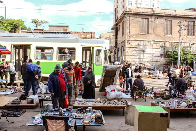 day, mode of transportation, market, street, men, sale, architecture, street market, large group of people, women, built structure, group of people, buy