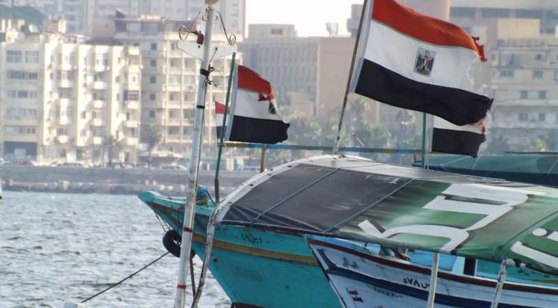boat, nautical vessel, mode of transportation, alexandria, symbol, outdoors, building, canal, dock, moored, colours, focus on foreground, nation, waterfront