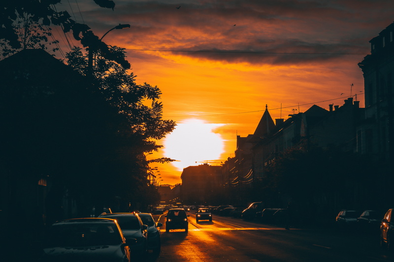 motor vehicle, travel, no people, plant, outdoors, building, city, night, cloud - sky, running, sunset, architecture, assorted, transportation, orange color