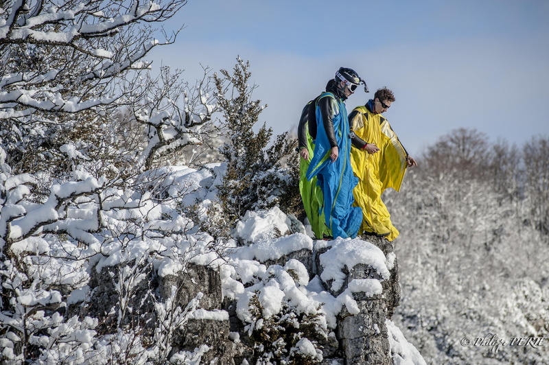 lifestyles, clothing, beyser, snow, pilots, day, tree, cold temperature, adventure, men, activity, real people, solid, extreme sports, rocks, wingsuit