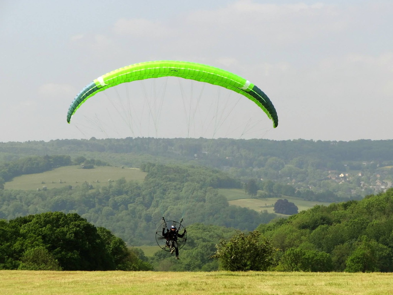 flying, beauty in nature, adventure, scenics - nature, sport, mid-air, nature, unrecognizable person, outdoors, real people, transportation, tree, paragliding