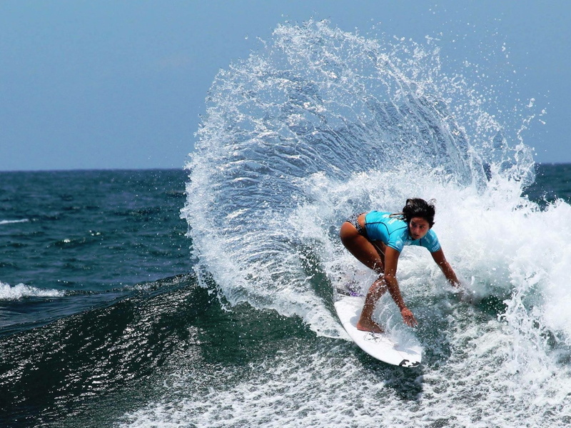 outdoors, sea, water, surfing, lifestyles, surf, daytime, skill, power in nature, marine, nature, full length, Girl, beauty in nature, speed, men, summer