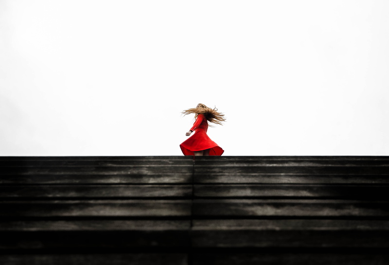 hair, adults only, 4K, one woman only, top, people, day, twirl, wearing, stairs, built structure, fashion, real people, woman in red, red, caucasian Ethnicity