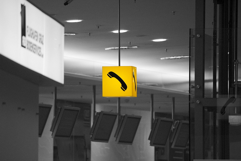 information, indoors, symbol, telephone, phone, communication, directional sign, 5K, signage, arrow symbol, report, black, ceiling, light, exit sign, architecture