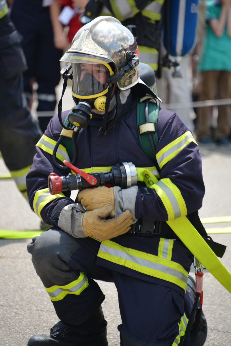 protective workwear, holding, exercise, day, fire, incidental people, headwear, rescue worker, protection, responsibility, safety, helmet, person, brand