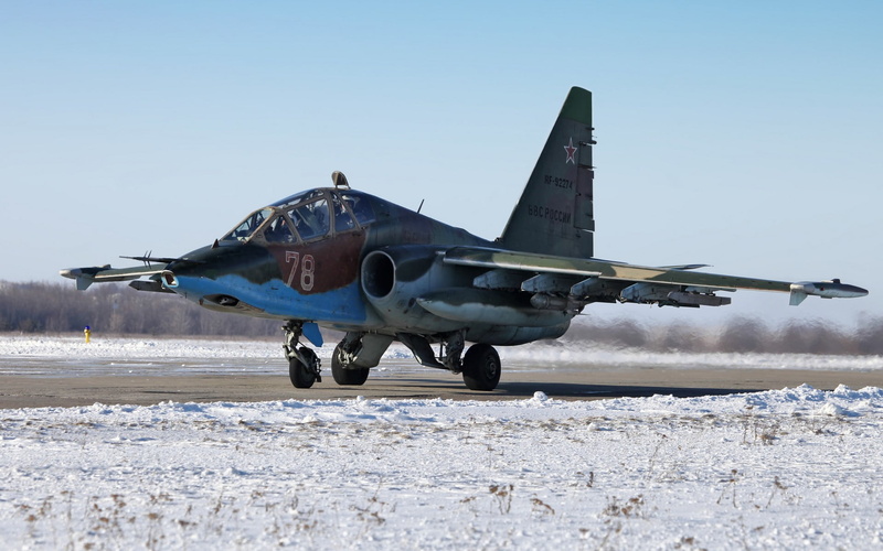snow, cold temperature, plane, gray, jet, land, air vehicle, SU-25 Frogfoot, sky, field, airplane, transportation, clear sky, air force, brown, no people