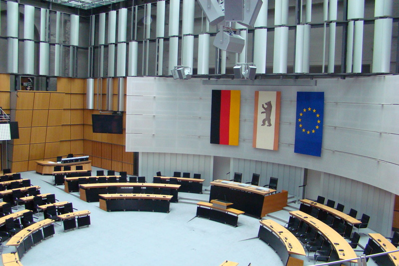 in a row, chair, building, wood - material, berlin, seat, chamber, focus on foreground, no people, built structure, bench, absence, education, technology