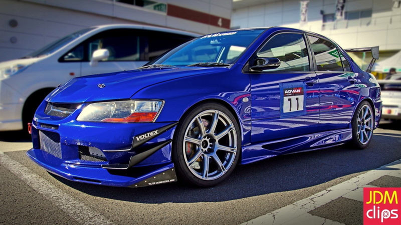 wheel, patriotism, car, mode of transportation, focus on foreground, flag, 1080P, parking lot, Mitsubishi Lancer, no people, city, tuning, motor vehicle