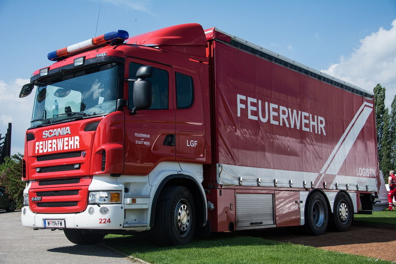 vehicle, semi-truck, business, semi, emergency, architecture, people, land vehicle, mode of transportation, red, transportation, nature, engine, wheel