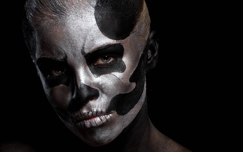 model, black background, fear, studio shot, halloween, make-up, body paint, evil, paint, human face, one person, demon - fictional character, human body part