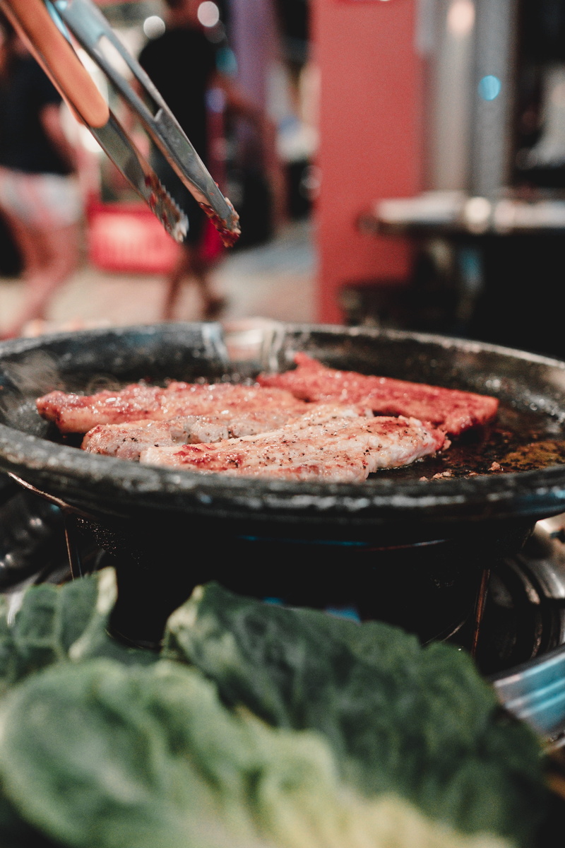 human, bbq, kitchen utensil, commercial kitchen, business, food, one person, appliance, preparation, pizza, beef, food and drink, restaurant, close-up
