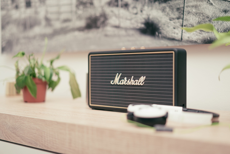 text, wood - material, top, still life, marshall, focus, plant, no people, bluetooth, focus on foreground, communication, brown, depth of field, technology