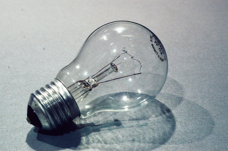 electricity, silver colored, light bulb, shiny, transparent, filament, no people, light, high angle view, still life, single object, indoors, glass - material
