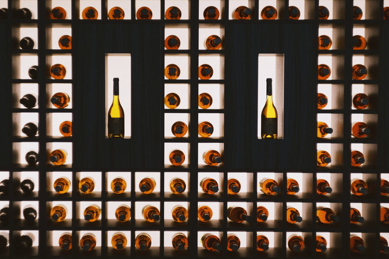 glass, container, indoors, wine, liquor, large group of objects, wine glass, sake, beverage, backgrounds, arrangement, wines, close-up, building, food and drink