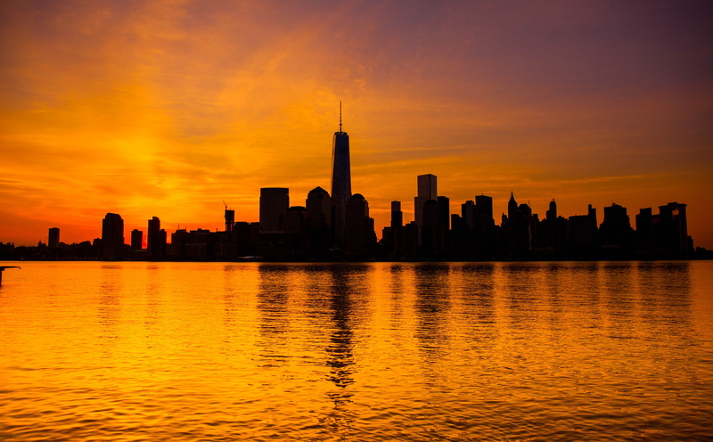 water, reflection, cloud - sky, new, oneworldtrade, skyscraper, outdoors, city, tower, built structure, world, no people, financial district, center, orange color