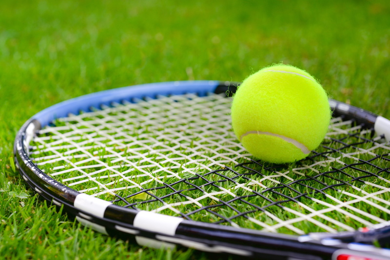 day, game, racket, green color, tennis, no people, two objects, leisure activity, nature, sports equipment, tennis racket, sport, tennis ball, yellow, ball