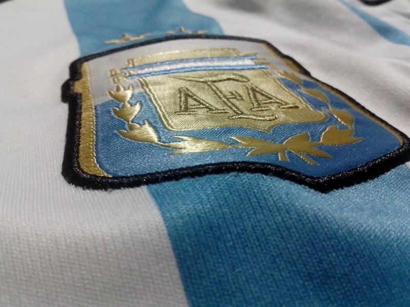human representation, representation, studio shot, selective focus, currency, Argentina, wealth, blue, text, no people, single object, metal, close-up