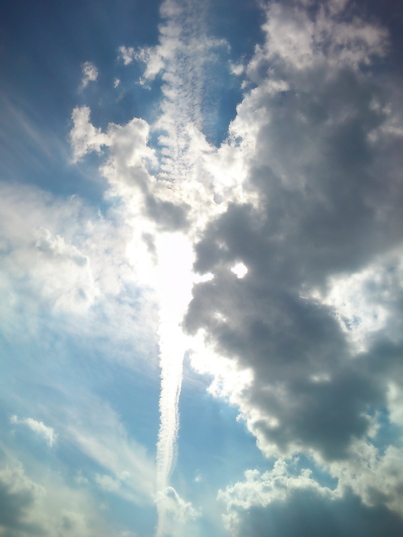 air vehicle, vapor trail, on the move, white color, outdoors, clouds, 2K, sunlight, patch , sky, cloudscape, airplane, pollution, beauty in nature, transportation