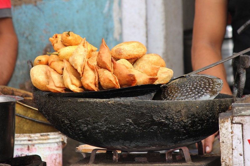 freshness, snack, empanada, hand, occupation, meal, samosas, fried food, one person, human body part, fried, preparation, barbecue, indian food, oil food