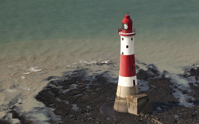 lighthouse, water, tower, building exterior, no people, sea, nature, architecture, built structure, land, safety, direction, red, beach, day, guidance