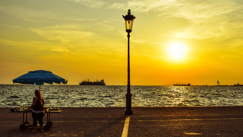 beauty in nature, street, sky, nature, water, sunset, lantern, vendor, horizon, lamp, greece, real people, 5K, outdoors, protection, lifestyles, afternoon