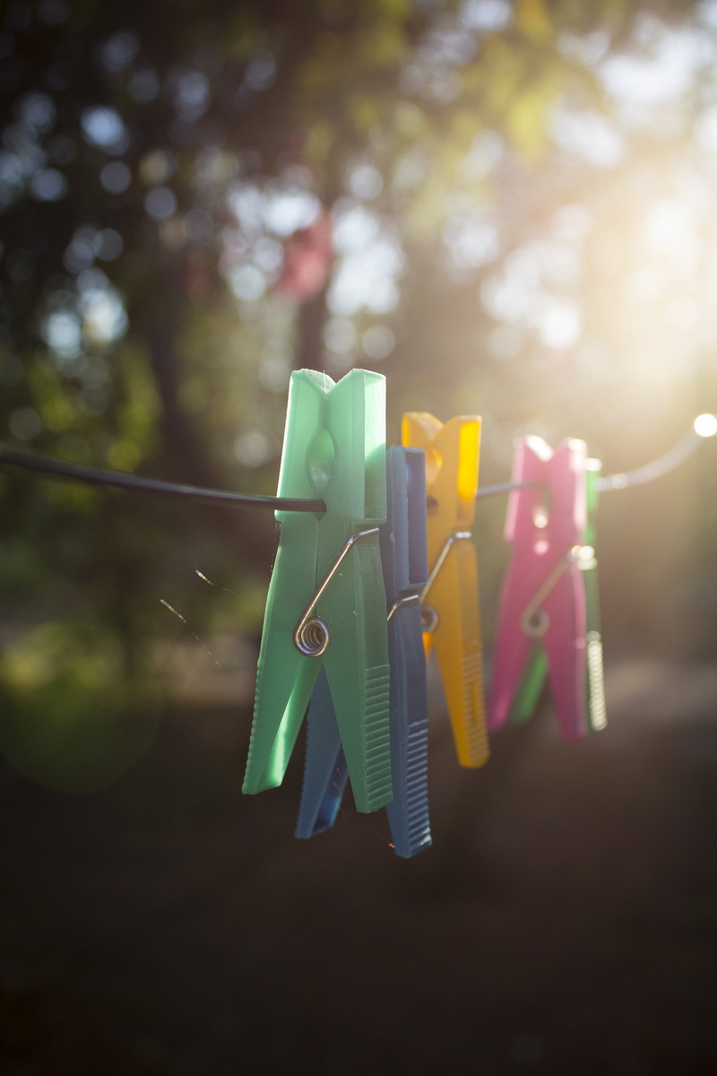 blur, variation, color, green color, focus on foreground, clothing, green, no people, laundry, rope, clip, pin, sunlight, 2K, wire, clips, blue, morning
