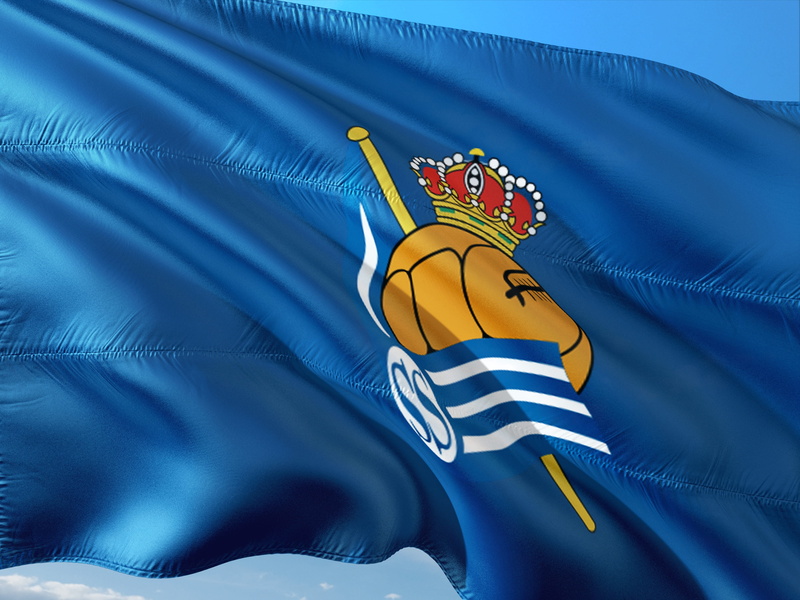 no people, outdoors, day, sport, textile, football, representation, waving, real sociedad san sebastian, blue, flag, yellow, patriotism, team sport, international