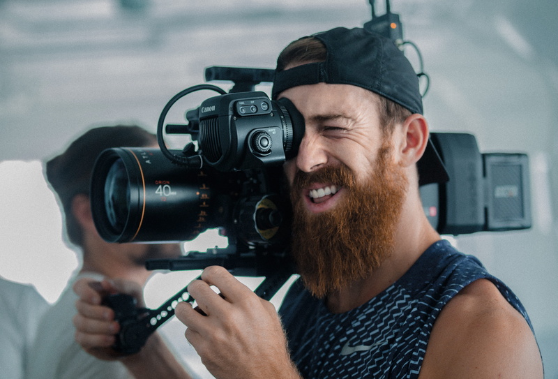 professional Occupation, filmmaking, camera Operator, man, indoors, using, video, one Man Only, smiling, one Person, camera, film Industry, camera - Photographic Equipment