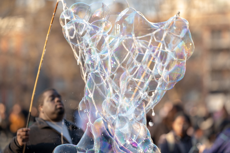 incidental people, crowd, motion, clothing, musical instrument, light, headshot, group of people, people, performance, outdoors, water, focus on foreground