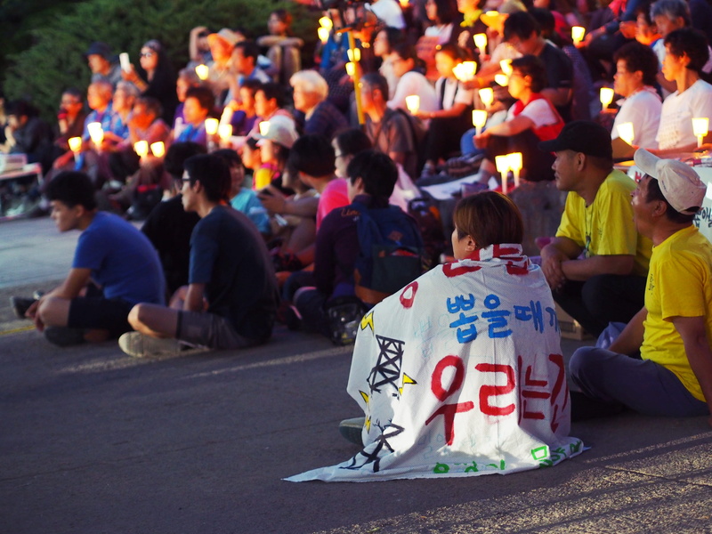 shoe, spectator, clothing, crash helmet, city, 4K, vigil, sitting, person, audience, lifestyles, festival, miryang, crowd, helmet, text, fight, communication