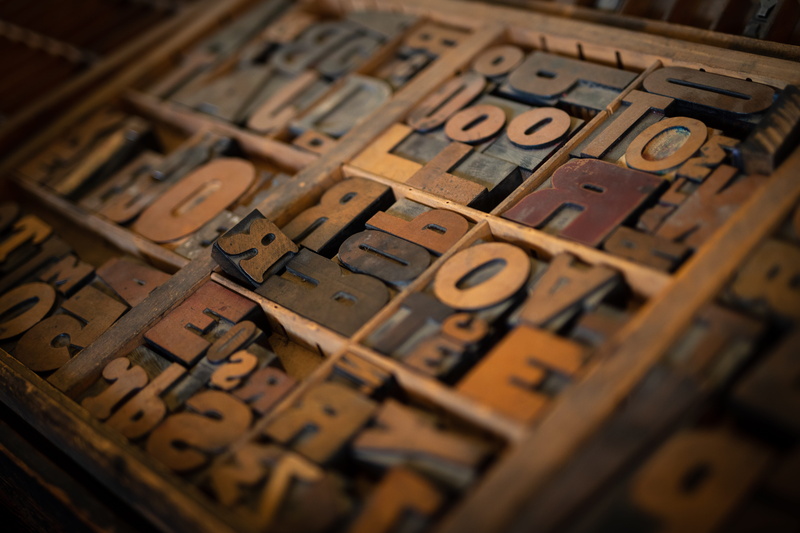 indoors, text, printing press, abundance, large group of objects, block shape, antique, brown, number, communication, alphabet, letter, close-up, decors