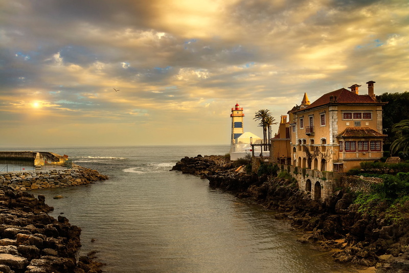 river, Sun, sea, water, palm trees, rock, old building, architecture, 1080P, clouds, birds, lighthouse, Portugal, stones
