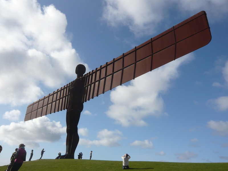 field, 2K, gateshead, nature, land, day, men, built structure, sky, adult, cloud - sky, incidental people, grass, angel of north, low angle view, leisure activity